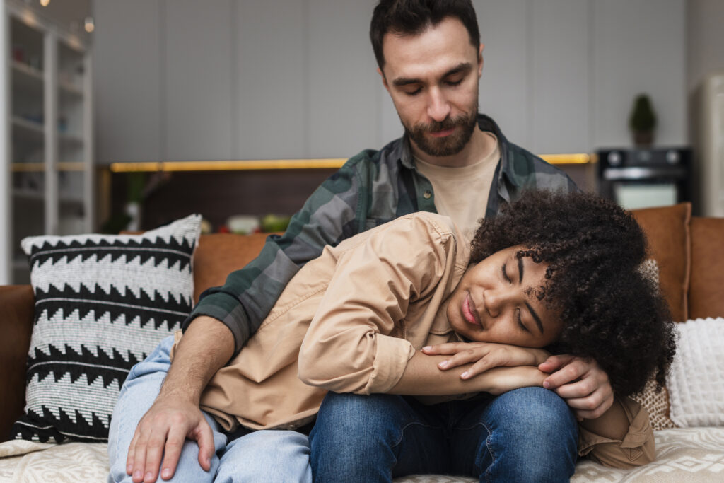 LGBTQ+ adult speaking with a trauma-informed therapist during an affirming therapy session for complex PTSD.